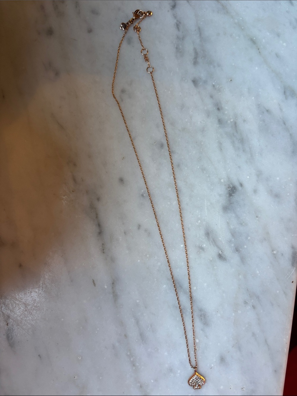 Tory Burch necklace with pave heart.